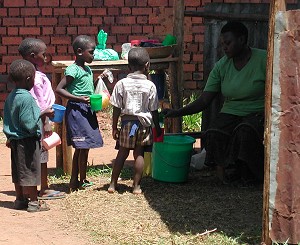 Children recieving milk in Uganda